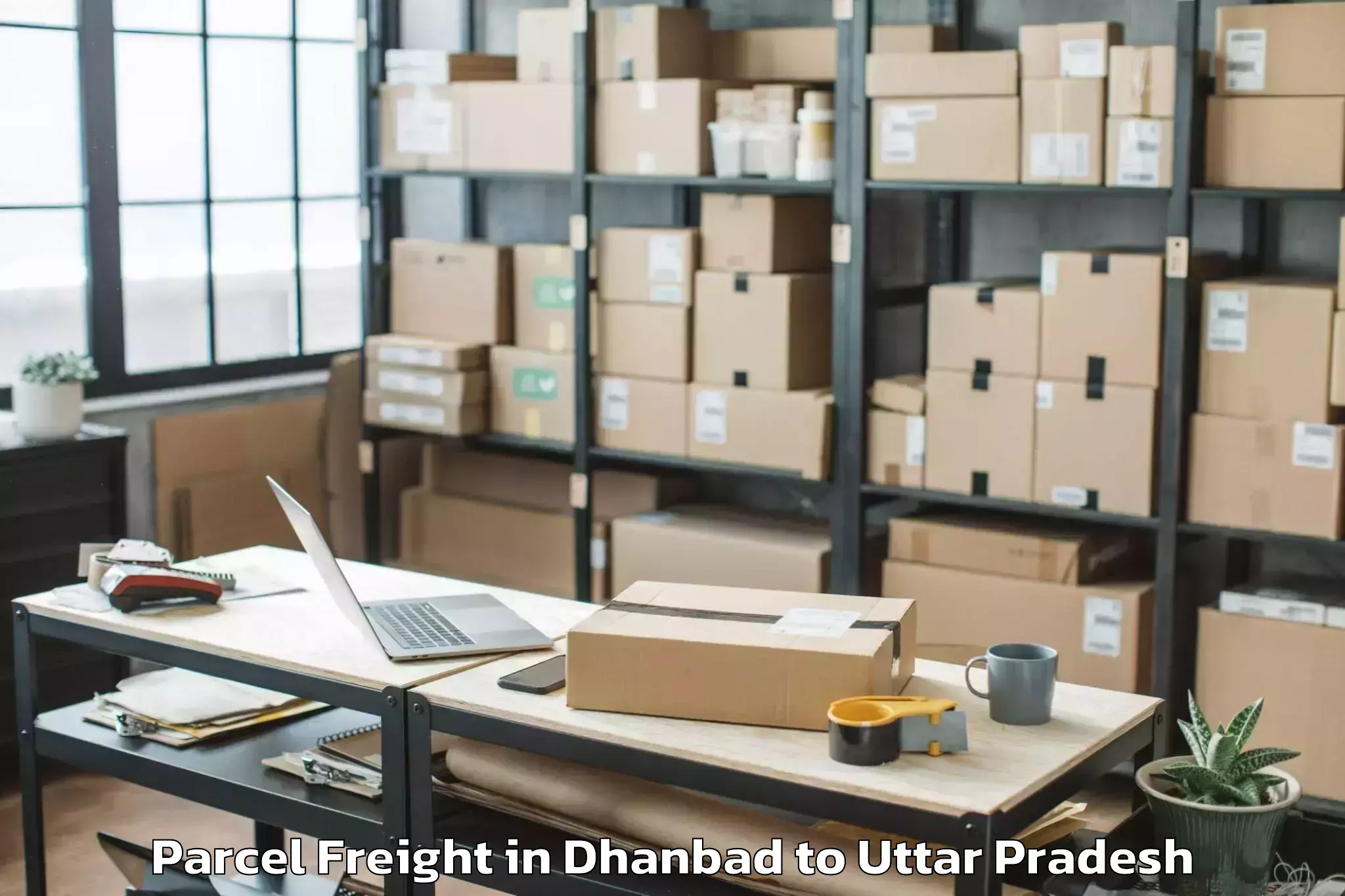 Easy Dhanbad to Maniar Parcel Freight Booking